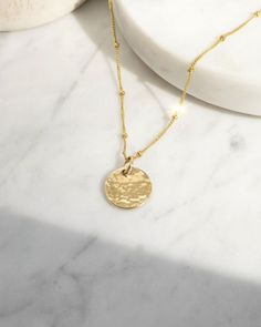 See the Good is a gentle reminder to look for the light, even on the hardest days. When you shift your focus to find the good, more of it appears, guiding you toward hope and positivity. MATERIAL 14k gold filled or .925 sterling silver Waterproof & hypoallergenic PRODUCT SPEC Charm: 1/2" disc Chain: 18" dainty satellite chain with 2" extender OTHER 6 month warranty Accompanied with Keep Go;ng card insert Comes in a jewelry pouch for longevity and easy gifting Good Necklace, Empathy Cards, See The Good, A Gentle Reminder, Word Bracelet, Layered Bracelets, Coin Necklace, Jewelry Pouch, Charm Necklace