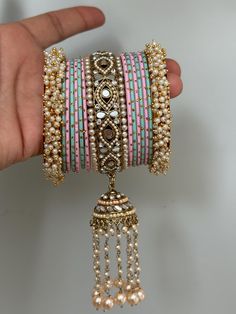 pearl kundan   bangles set for both hands. Pink Kundan Bangle For Gift, Pink Kundan Bangle For Festivals, Pink Kundan Bangle For Festive Occasions, Pink Bollywood Bracelets For Festivals, Pink Meenakari Bracelets For Festivals, Traditional Pink Meenakari Bracelets, Festive Pink Bracelets With Gota Work, Festive Pink Bracelet With Gota Work, Pink Bollywood Bangle For Festivals