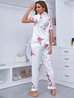 Experience nightly comfort in our Notch Collar Floral Satin Pajama Set. Elevate your evenings with an elegant touch as delicate florals and plants grace your silhouette. Crafted from luxurious satin, the button-front top features exquisite contrast lace and binding. Short sleeves and a loose fit ensure unrestricted movement. Enhance your bedtime routine with this charming ensemble, ideal for relaxing family moments. Specifications: Pattern Type: Floral, Plants Type: Pant Sets Neckline: Collar De White Floral Print Sets For Home, White Floral Print Home Sets, Elegant Floral Print Short Sleeve Sets, Fitted Floral Print Sleep Sets, Spring Nightwear Sets Fitted, Fitted Night Sets For Spring, Blouse And Pants Set, Blouse And Pants, Satin Pajama Set