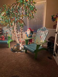 a christmas tree is decorated with lights and santa claus sitting under the fake palm tree