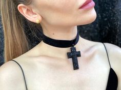 A spectacular neck accessory in the form of a large black cross with shiny black rhinestones on a velvet ribbon will perfectly complement your look for a gothic Halloween party or photo shoot. 100% designed and handmade by our designers ( SETA Design studio in Kyiv). It will be securely packed in a box. Feel free to contact us if you have any questions. We accept return. Contact us within 3 days of delivery. Delivery of goods is returned within 7 days from the date of delivery. We do not accept Black Cross Pendant Jewelry For Halloween, Black Cross Jewelry For Halloween, Gothic Black Cross Necklace Gift, Black Gothic Jewelry For Concerts, Gothic Black Crucifix Cross Necklace, Black Cross Choker Necklace, Black Cross Choker As Gift, Black Punk Cross Necklace, Punk Black Cross Necklace