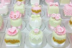 a table topped with lots of cupcakes and cakes