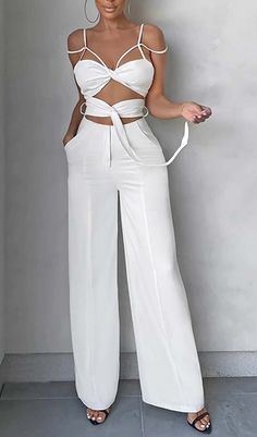 This white jumpsuit is a perfect choice for a chic summer look! Featuring cutout detailing and sleeveless design, it's an effortless way to look stylish! Gentle Dry Clean Only Colour may vary due to lighting on images. The product images (without model) are closest to the true colour of the product.Item runs true to size chart and is cut to suit our size chart. Please refer to our size chart for the best fit. Do not size up or down. White High-waist Jumpsuits And Rompers For Summer, White High Waist Jumpsuits And Rompers For Summer, Casual Cutout Jumpsuits And Rompers For Spring, Casual Spring Jumpsuits And Rompers With Cutout, Spring Bottoms With Cutout Details, Chic White Jumpsuits And Rompers For Summer, Summer White Jumpsuits And Rompers For Night Out, White Summer Jumpsuits For Night Out, White Solid Color Jumpsuit For Spring