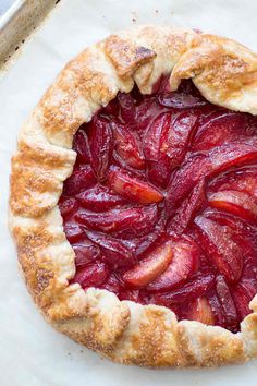 a pie that has some fruit on it