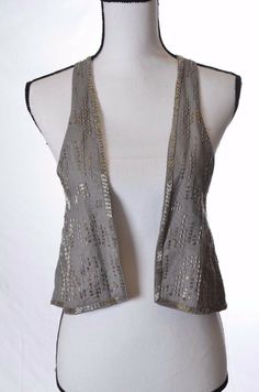 Cute vest with silver beading open front and gathered in back. pit to pit - 17" length - 18" Embellished Bohemian Sleeveless Vest, Fitted Embellished Vest For Fall, Bohemian Fitted Vest For Party, Fitted Bohemian Vest For Party, Fitted Embellished Vest, Fall Sleeveless Vest With Sequins, Sleeveless Fall Vest With Sequins, Sleeveless Sequined Vest For Fall, Front Open