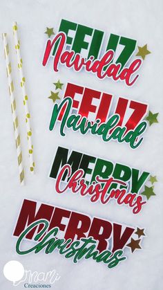 four christmas stickers on top of a white sheet with green and red foil stars