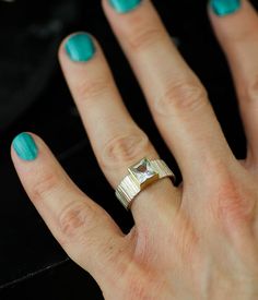 Part of my Forest Floor series, this bold ring evokes cold, crisp days and the smell of wood and leaves.

Elements of the natural world are deconstructed and conveyed in lines, texture, and color; the finished product features a clean and clear white topaz, secured by a 14K yellow gold bezel and presented on a hand-textured, sterling silver band.

IMPORTANT: This is a ready-to-ship piece—NOT made to order—available in size 7.25 only.

Not your size? Most rings can be easily resized by a reputable jeweler.

A customizable version of this ring is available here: Black Or White Square Fallen Branches Lines Texture, Neutral Jewelry, Ship Wedding, Wedding Pendant, Bold Rings, Forest Floor, Eco Friendly Jewelry, White Square, Wedding Art