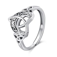 a celtic style ring with an openwork design on the front and side, in white gold