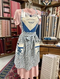 an apron dress is on display in a shop