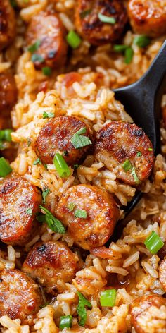 sausage and rice in a skillet with a spoon