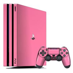 a pink sony playstation 4 console and game controller next to each other on a white background