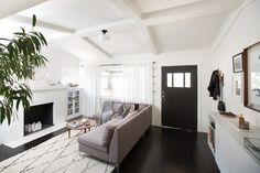 a living room filled with furniture and a fire place