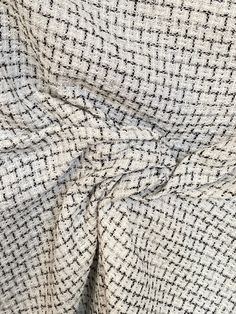 Black and white boucle suiting fabric. Black on White, textured boucle fabric, has silver lurex fibers woven in the fabric. Suitable for most winter project. Composition is assorted fibers. Width is 150cm. Price is per running meter. i.e for 1 quantity unit you will receive  1m x 1.5m Orders over one meter will be a continuous length of fabric. Black And White Fabric Texture, White Fabric Texture, Costume Noir, Tweed Pattern, Winter Project, Black And White Tweed, Suiting Fabric, White Tweed, Black And White Fabric