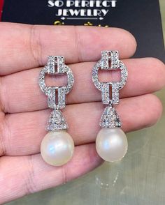 We are presenting you a HUGE pair of Art Deco, CHANDELIER, Genuine, LUSTROUS PURE WHITE, South Sea Pearls, extremely FINE AA+, LUSTROUS and Rare! Accenting the 2 pearls are 98 pieces of E/VS Natural diamonds, weighting a total of 1.58 carats. Set in GORGEOUSLY designed 18K solid white gold Art Deco earrings! PERFECT FOR SPECIAL OCCASIONS! SO BIG AND GORGEOUS! EVERYONE WILL FALL IN LOVE WITH THEM THE MINUTE THEY SEE YOU WEARING THEM! ONLY ONE ITEM AVAILABLE!! NO DUPLICATES!! WHAT YOU SEE IN THE P Exquisite White Cubic Zirconia Chandelier Earrings, Exquisite Diamond White Pearl Earrings For Wedding, Luxury Diamond White Bridal Earrings With Elegant Design, Luxury Diamond Pearl Earrings For Wedding, Elegant White Round Chandelier Earrings, White Diamond Pearl Earrings For Wedding, Luxury White Chandelier Earrings For Evening, Elegant White Drop Chandelier Earrings, Luxury White Bridal Earrings For Evening