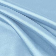 Payton DUSTY BLUE Faux Silk Stretch Charmeuse Satin Fabric - 10017 Charmeuse is a lightweight fabric woven with a satin weave, in which the warp threads cross over four or more of the backing threads. These float threads give the front of the fabric a smooth finish—lustrous and reflective—whereas the back has a dull finish. This charmeuse satin has a very soft silky feel, much like that of a silk. The luster and delicate hand make charmeuse suited to bridal gowns, lingerie, flowing evening gowns Baby Blue Aesthetic, Dress Patterns Free, Wedding Apparel, Crafts Decor, Free Dresses, Blue Aesthetic, Dusty Blue, Dressmaking, Satin Fabric