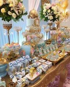 a table filled with lots of cakes and desserts