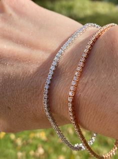 Simple and brilliant, this classic tennis bracelet features 81 round, brilliant diamonds framed in 14k Rose gold. Length: 7 inches Width: 1.90 mm Diamond Frame, Diamond Tennis Bracelet, Tennis Bracelet Diamond, Brilliant Diamond, Tennis Bracelet, Round Brilliant, Tennis, Diamonds, Rose Gold