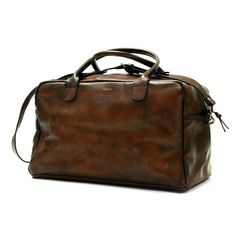 Handcrafted in soft leather and hand polished for a vintage patina, the John Woodbridge Weekend Bag will be your faithful companion for a quick getaway or your trips to the gym. This cabin-sized model is ready to hop on a plane whenever you are. For all you boxers out there: It has room enough to fit your boxing gloves.- Dimensions : 50 x 25 x 25 cm- One pocket with zip closure- One pocket for your phone/passport- Cotton-lined interior- Removable, adjustable leather strap with brass hardware Rolltop Backpack, Leather Weekender Bag, Quick Getaway, Motorcycle Travel, Overnight Bags, Weekend Bag, Vintage Baseball, Wood Bridge, A Plane