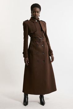 Feel Elevated No Matter The Weather In Our Midaxi Length Coat, Made In High Quality, Thick Italian Wool, Featuring A Fit That Flatters The Figure And A Dramatic, Long Length. The Double Breasted Buttons And Collared Neckline Make For A Classic, Traditional Piece That Maintains A Heightened Level Of Formality. Wear It Over Any Outfit, Whether Heading Out For Dinner Or To The Office. Italian Wool Tailored Belted Trench Coat High Quality Italian Wool Fabric Flattering Fitted Bodice Straight Hanging Trench Coat Outfit Italy, Trench Coat With Dress, High Collar Coat, Fancy Suits, Wool Dresses, Bride Jumpsuit, Petite Wedding Guest Dresses, Vintage Trench Coat, Pirate Girl