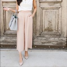 Elevate Your Wardrobe With These Stylish Leith Wide-Leg Trousers In A Beautiful Tan Taupe Color. These Pants Are Perfect For Any Occasion And Feature A Cropped Design That Adds A Touch Of Modernity To Your Outfit. The Xs Size Is Ideal For Women Who Prefer A Regular Fit, While The Wide-Leg Design Provides A Comfortable And Chic Look. The Pants Also Come With A Brand Tag, Making Them A Great Addition To Your Collection. Whether You're Dressing Up Or Down, These Leith Trousers Will Surely Make A St Versatile Spring Office Dress Pants, Beige Workwear Culottes With Pockets, Chic Wide Leg Pants For Brunch, Chic Dress Pants With Pockets For Spring, Chic Spring Dress Pants With Pockets, Elegant High Waist Pants For Brunch, Beige Culottes For Spring Workwear, Chic Beige Culottes With Pockets, Chic Pants With Pockets For Brunch