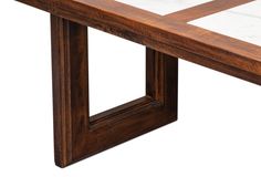 a wooden table with marble top on a white background