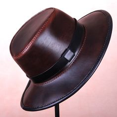 Leather Indiana Jones Fedora Hat Brown Fedora hat made of genuine leather. The style of the Hat is inspired by the adventures of Indiana Jones. A nice, practical hat for everyday use. Inside the edge binding is a stiff wire that can be formed by you to give the brim your own style. This hat is perfect for your outdoor adventures and western or steampunk style outfits. Adjustable Leather Steampunk Hat, Brown Steampunk Brimmed Hats, Brown Leather Steampunk Hat, Steampunk Brown Leather Top Hat, Steampunk Helmet, Brown Steampunk Brimmed Top Hat, Indiana Jones Fedora, Leather Top Hat, Brown Fedora