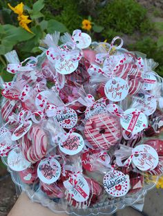 a clear bowl filled with valentine's day candies