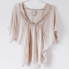 Beautiful Top. Sheer So You Will Want To Wear Something Under. Beautiful Details. Wonderful Condition. Never Worn Reasonable Offers Will Be Considered. _ Get $5 Off Your First Purchase On Poshmark By Using Code Nativeasfolk At Signup! Neutral V-neck Beach Top, Elegant Short Sleeve Beach Blouse, Elegant Short Sleeve Beach Top, Elegant Beige Beach Tops, Chic Embellished Beige Tops, Chic Beige Embellished Tops, Elegant Neutral V-neck Top, Elegant Beige Embellished Tops, Elegant Embellished Beige Tops