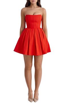 A corseted bodice and strapless silhouette add timeless charm to a fit-and-flare dress cut at a stem-baring length for soirée-ready appeal. Exclusive retailer Hidden back-zip closure Strapless Lined 65% Richcel viscose, 35% polyester Dry clean Imported House Of Cb Dresses Red, Strapless Red Dress Short, Red Leather Mini Dress, Red Corset Dress, Cute Formal Dresses, Red Strapless Dress, Skater Style Dress, Christmas Dresses, Boho Summer Outfits