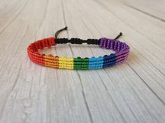 Rainbow woven bracelet. Tiny and delicate, made in micro macrame technique. Super skinny Unisex rainbow bracelet. Adjustable length. Perfect looks and comfortable to wear.  If you  have any question, please message me.  Thank You Rainbow Friendship Bracelets With Sliding Knot, Rainbow Adjustable Cord Friendship Bracelet As Gift, Bohemian Rainbow Friendship Bracelets With Sliding Knot, Bohemian Rainbow Friendship Bracelet With Sliding Knot, Handmade Rainbow Braided Friendship Bracelets, Rainbow Adjustable Cord Bracelet As Gift, Rainbow Adjustable Cord Bracelet For Gift, Bohemian Rainbow Bracelets With Adjustable Cord, Bohemian Rainbow Braided Bracelets With Sliding Knot