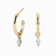 * In stock in yellow gold * Sold as a pair * Hoop length: approx. 13.7mm * Hoop & charm length: 20mm * Hoop thickness: approx. 1.7mm * Natural diamonds weight: approx. 0.20ctw * Earring post: 10mm long * Solid gold pushback * Made of recycled precious metal and ethically sourced gemstones * Packaged in a recyclable kraft jewelry box Modern Yellow Gold Dangle Huggie Earrings, Elegant Charms Huggie Earrings, Elegant Yellow Gold Huggie Earrings With Charms, Timeless Dangle Hoop Earrings, Elegant Yellow Gold Hoop Earrings With Charms, Elegant Gold Huggie Earrings With Dangling Charms, Elegant 14k Gold Hoop Earrings With Charms, Dainty Yellow Gold Huggie Earrings With Dangling Charms, Yellow Gold Hoop Earrings With Charms In 14k Gold