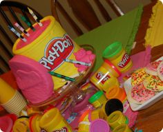 a table topped with lots of toys and condiments