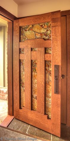 a wooden door with decorative glass panels