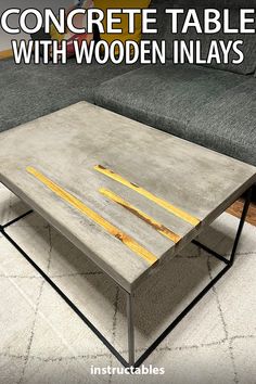 concrete coffee table with wooden inlays and text that reads concrete table with wooden inlays