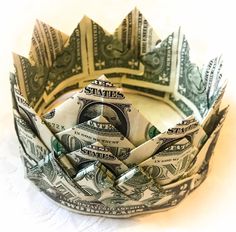 a crown made out of money sitting on top of a table