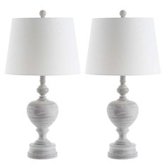 two white table lamps sitting next to each other