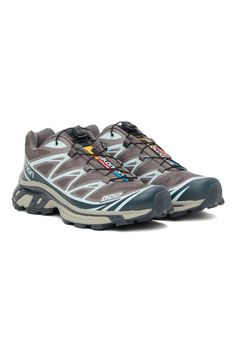 Gray & Blue XT-6 Sneakers by Salomon on Sale Gray Athleisure Sneakers For Trail Running, Gray Athleisure Trail Running Sneakers, Gray Sporty Trail Running Sneakers, Gray Sporty Trail Running Shoes With Vibram Sole, Gray Trail Running Shoes With Vibram Sole, Gray Trail Running Shoes With Vibram Sole For Streetwear, Gray Trail Running Sneakers With Boost Midsole, Dynamic Gray Sneakers For Trail Running, Dynamic Blue Sneakers For Hiking