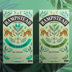 two boxes of green tea with tigers on the front and back sides, sitting next to each other