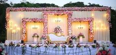 a decorated stage with flowers and candles