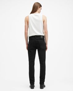 Your favorite skinny jeans, but better. Introducing the Sid – a familiar fit with refined detailing. Expertly crafted from an organic cotton blend fabric with a soft hand-feel and a little bit of stretch. They're a classic skinny fit with contemporary shaping in the waist and a workwear-inspired aesthetic. Complete with reinforced pockets and our embossed leather patch and washer. The Sid brings our signature attitude up to date with maximum comfort ensured.  In honor of our 30th anniversary, we've relaunched the AllSaints denim collection. Get to know the core staples – we've made them even better than before. These jeans are designed to be skinny fitting Button closure Mid-rise Five pocket construction Stretch denim Reinforced back pockets Interior printed pocket bags Embossed leather pa Fitted Allsaints Bottoms For Spring, Allsaints Cotton Bottoms For Spring, Allsaints Casual Fitted Bottoms, Inspired Aesthetic, Denim Collection, Going Out Outfits, 30th Anniversary, Sweater Sale, Sweaters And Jeans