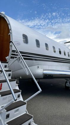 an airplane with stairs leading up to it