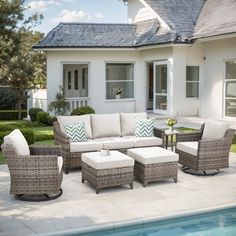 an outdoor patio with furniture and a pool