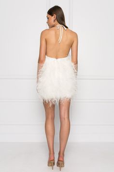 Step out in confidence in the SOLVEIG feather dress. With it’s eye-catching feathers and deep plunge halter neckline, this showstopper will elevate your look at your next event to exquisite new heights. White Halter neck Deep plunge neckline Outer Shell: 100% Ostrich Feathers Lining: 100% Polyester Available for PRE-ORDER. Orders are expected to ship by mid-August. Evening Mini Dress With Ostrich Feathers, White Ostrich Feather Evening Dress, Chic Ostrich Feather Dress For Night Out, Chic Feathered Mini Dress For Wedding, Chic Mini Dress With Feathers For Wedding, Summer Sleeveless Dress With Ostrich Feathers, Chic Ostrich Feather Mini Dress For Party, Fitted White Dress With Ostrich Feathers, White Feathered Mini Dress For Evening