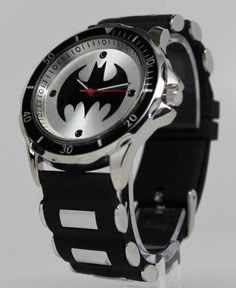 Batman watch that is a young adult / adult sized watch that features the Batman logo. Uses Japan movement. Stainless steel caseback. The bracelet is silicon / rubber in black with metallic accents. Perfect for the Batman in your life. Watch case measures about 1.7 inches in diameter. Bracelet is 1 inches wide. Watch is shipped with a crown stopper, protective film of the glass/crystal, and a protective film/sticker on the caseback. The crown stopper prolongs the battery. Watch is about 10.5 inch Casual Silver Watch With Stopwatch, Batman Furniture, Batman Gadgets, Batman Jewelry, Batman Signal, Iron Batman, Batman Wedding Rings, Batman Watch, The Batman Logo