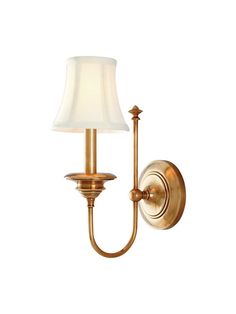 an antique brass wall light with a white shade on the top and bottom half of it