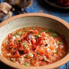 a bowl filled with soup on top of a table