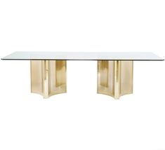 a glass and brass dining table