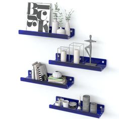 three blue shelves with various items on them in the shape of rectangles and shapes