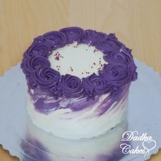 a purple and white cake on a plate