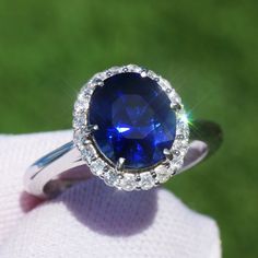 A Breathtakingly Striking HANDMADE 14k White Gold Ring with Beautiful Oval Cut Sapphire in Blue color! The GEM is 3.52CT and measures 9.42x8.12x5.94 mm! This Stone will take your breath away, especially on the sunlight! You will want to look at this stone endlessly. The mounting is a masterpiece! HANDMADE 14K White Gold Diamond Mounting (tested), that was is custom made to Accommodate this Beauty of a Gem in a V-prongs setting! Super FINE Workmanship on the Diamond v-split setting with 20 pcs Brilliant Full Cut Diamonds in GH color, SI1 clarity, totaling to approx  0.33 ct ! Fabulous Braided Band and Diamond Gallery! The Entire Top's outline is 12.6x11.2 mm- HUGE. The Ring weights 4.6 g, nice and SOLID. Sits 7.1 mm off the top of the finger. Finger size 7(Free Re-sizing with purchase). Cen Elegant Vvs Clarity Sapphire Ring, Vvs Clarity Lab-created Sapphire Ring For Wedding, Vvs Clarity Sapphire Rings, Oval Sapphire Jewelry With Vvs Clarity, Luxury Oval Diamond-cut Sapphire Ring, Custom Ring Designs, Sapphire Diamond Ring, Expensive Jewelry, 14k White Gold Ring